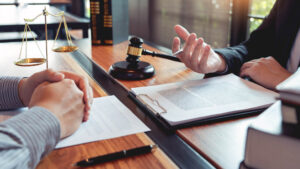 a judge and a person talking in an office